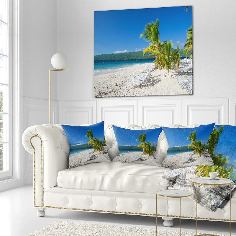 Throw blanket with a modern twist -Designart 'Beach Coconut Palms in Wind' Seashore Photo Throw Blanket